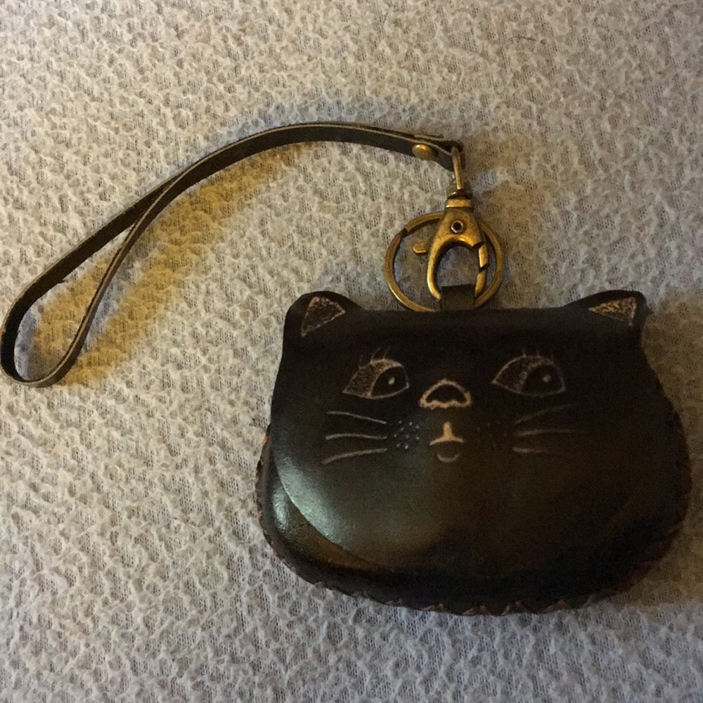 Handmade leather kitten treasure/change purse. Cute little pet for your “pet”.